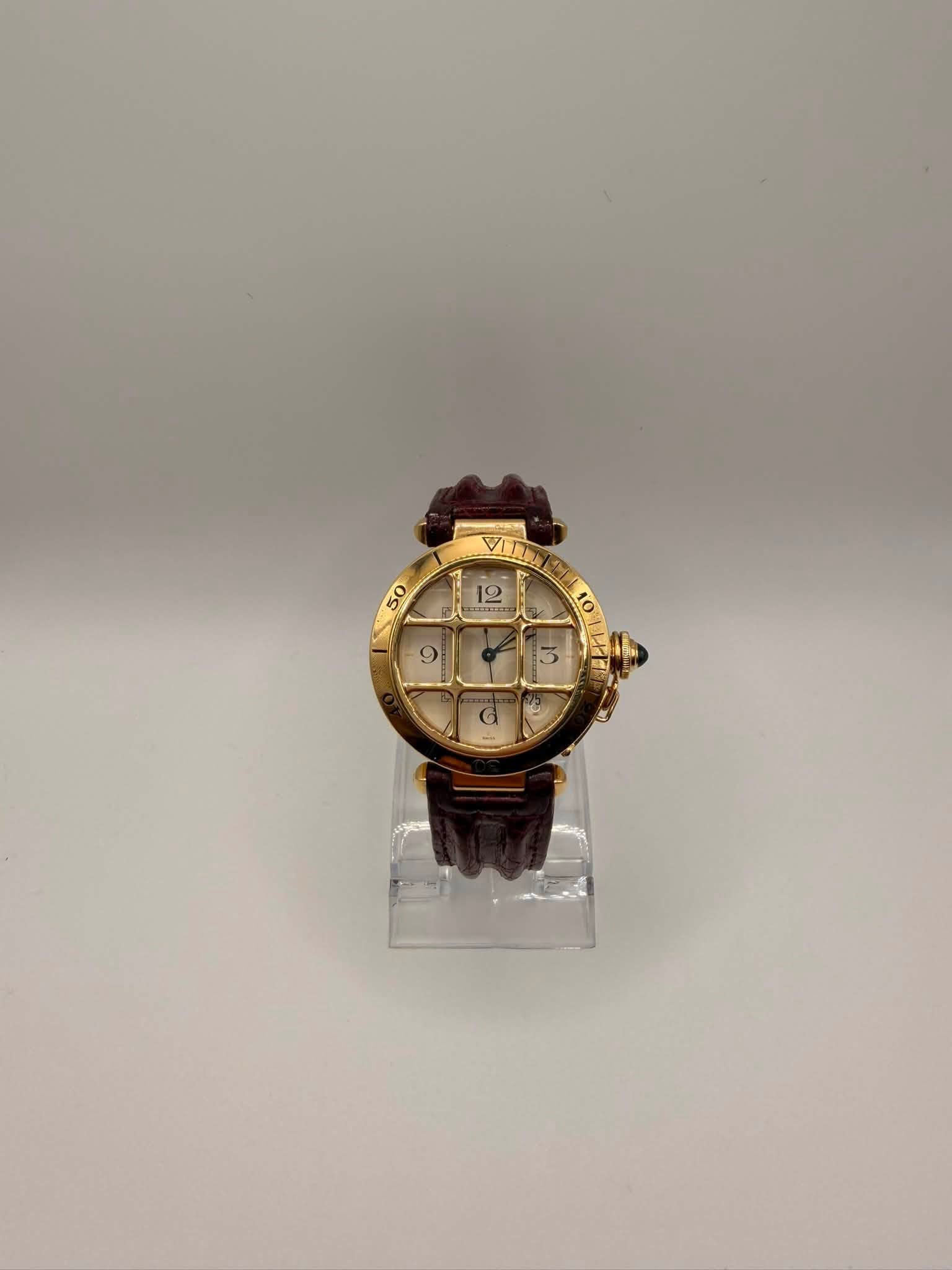 May be an image of wrist watch and text