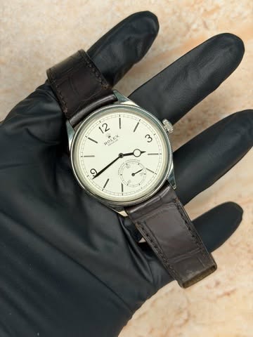 May be an image of wrist watch and text that says '12 I ROLEX OLEX Med / 3 و ۱'