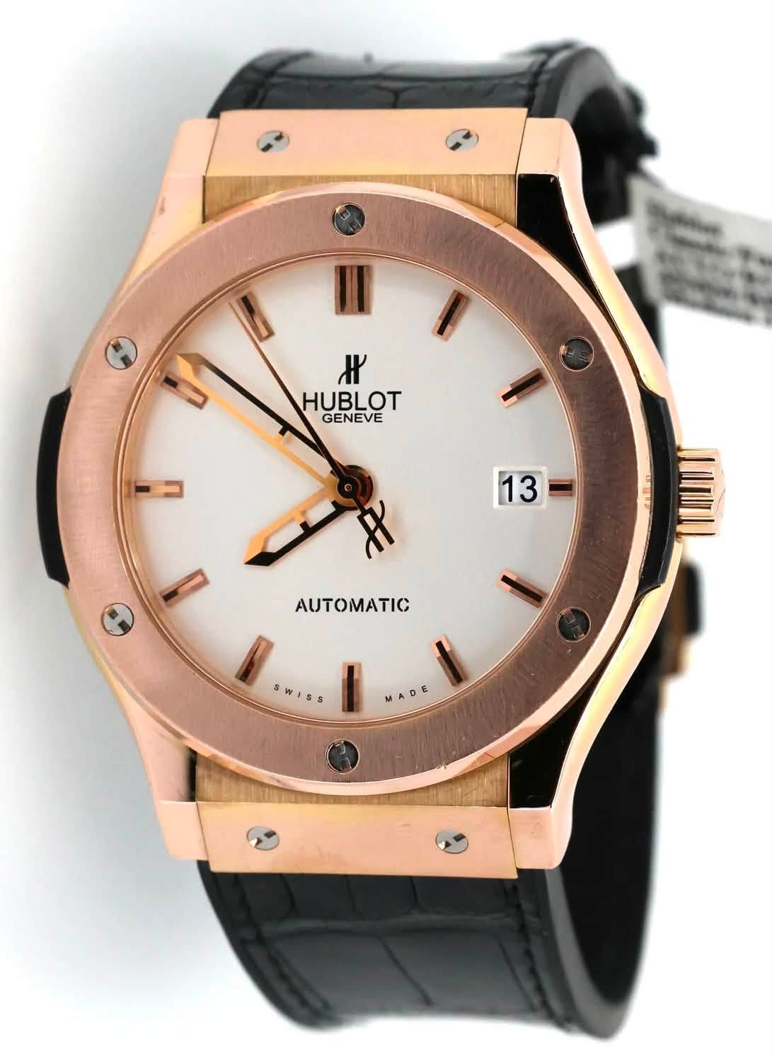 May be an image of wrist watch and text that says '/8٢ HUBLOT GENEVE ٧ 13 - I SWISS MADE E'