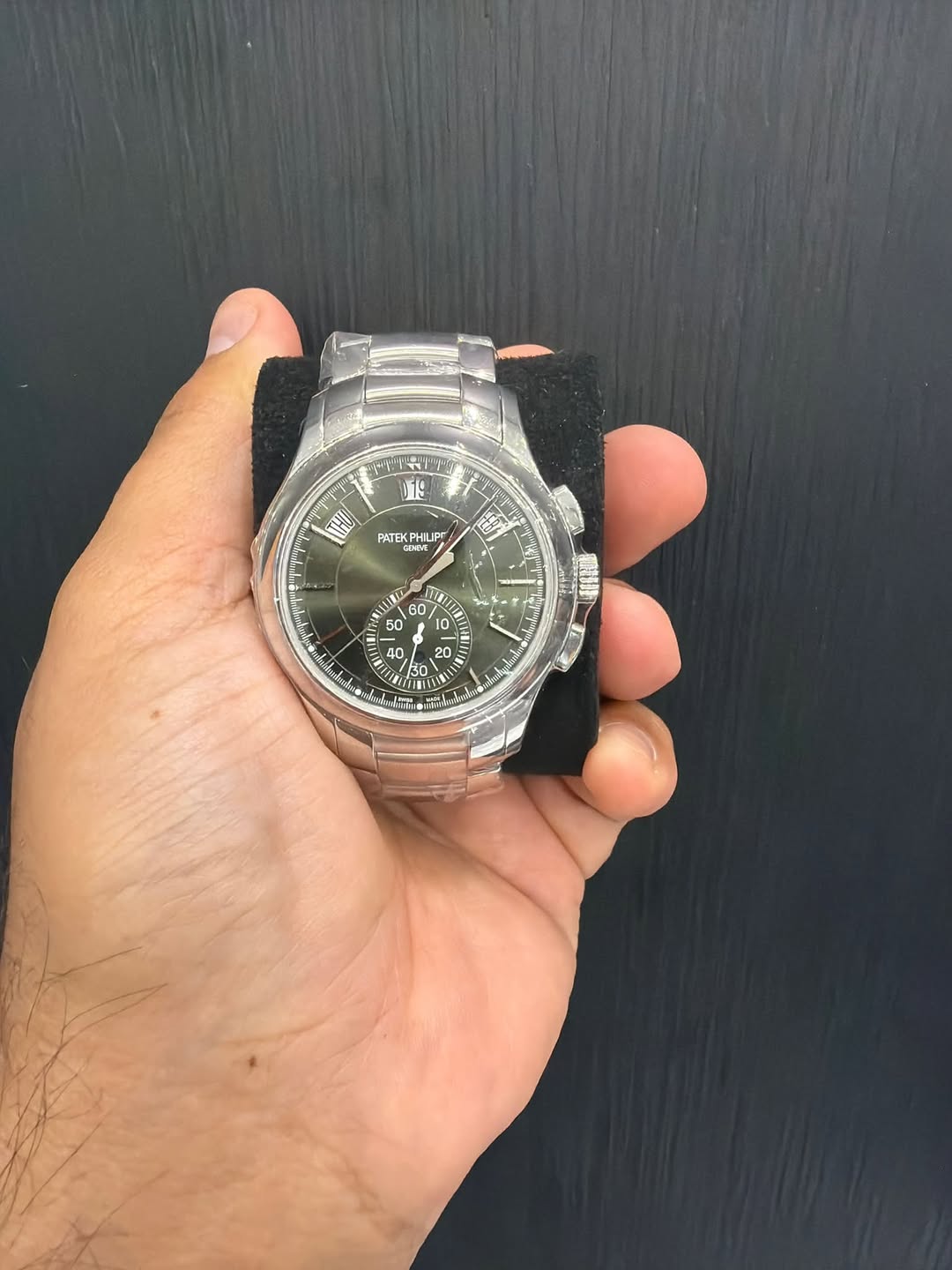 May be an image of wrist watch and text