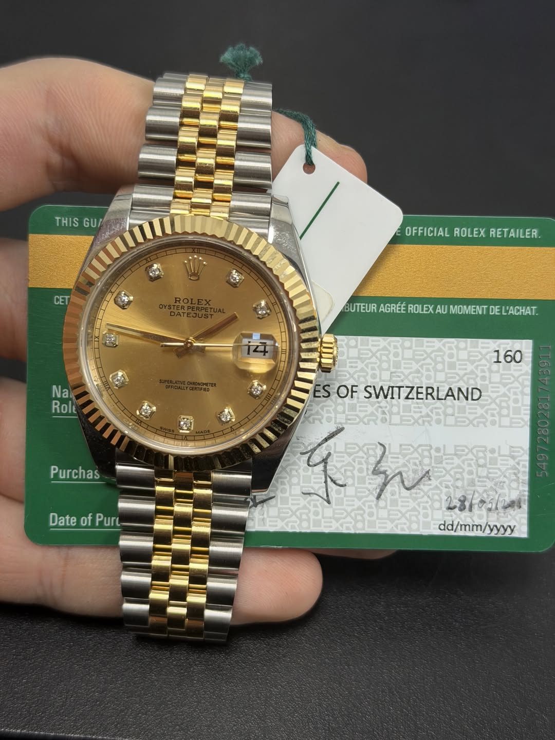 May be an image of wrist watch and text