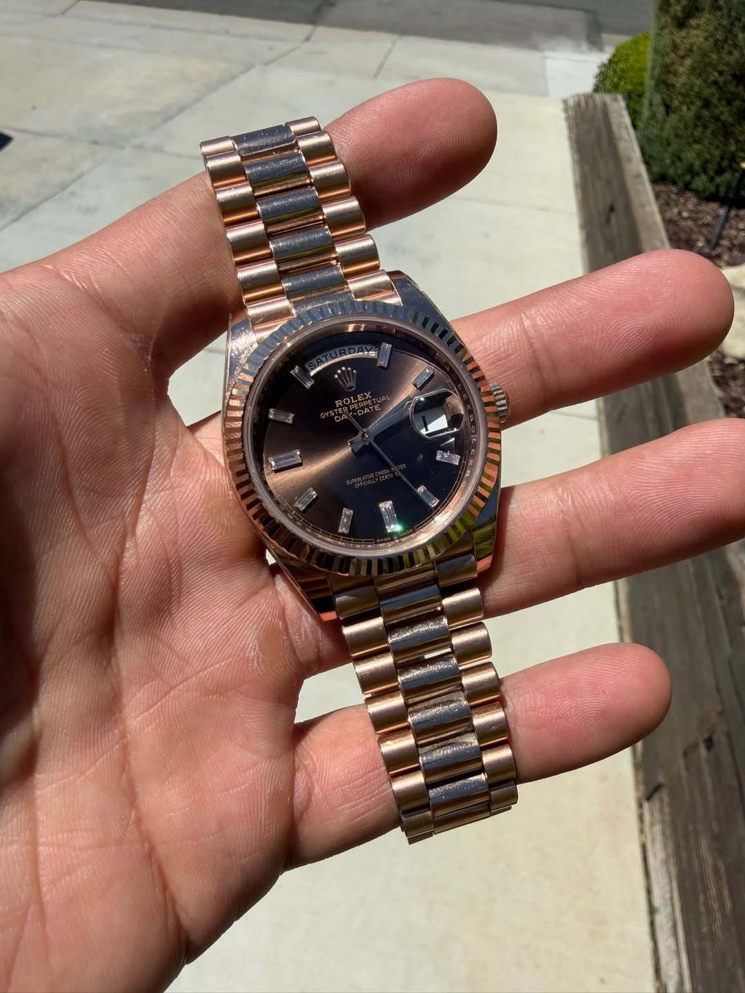May be an image of wrist watch and text