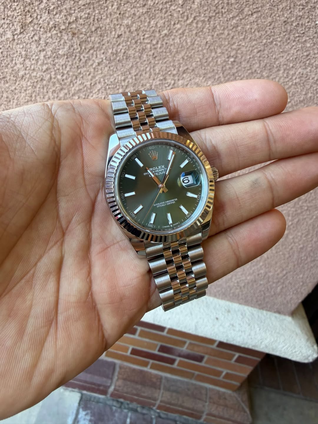 May be an image of wrist watch and text