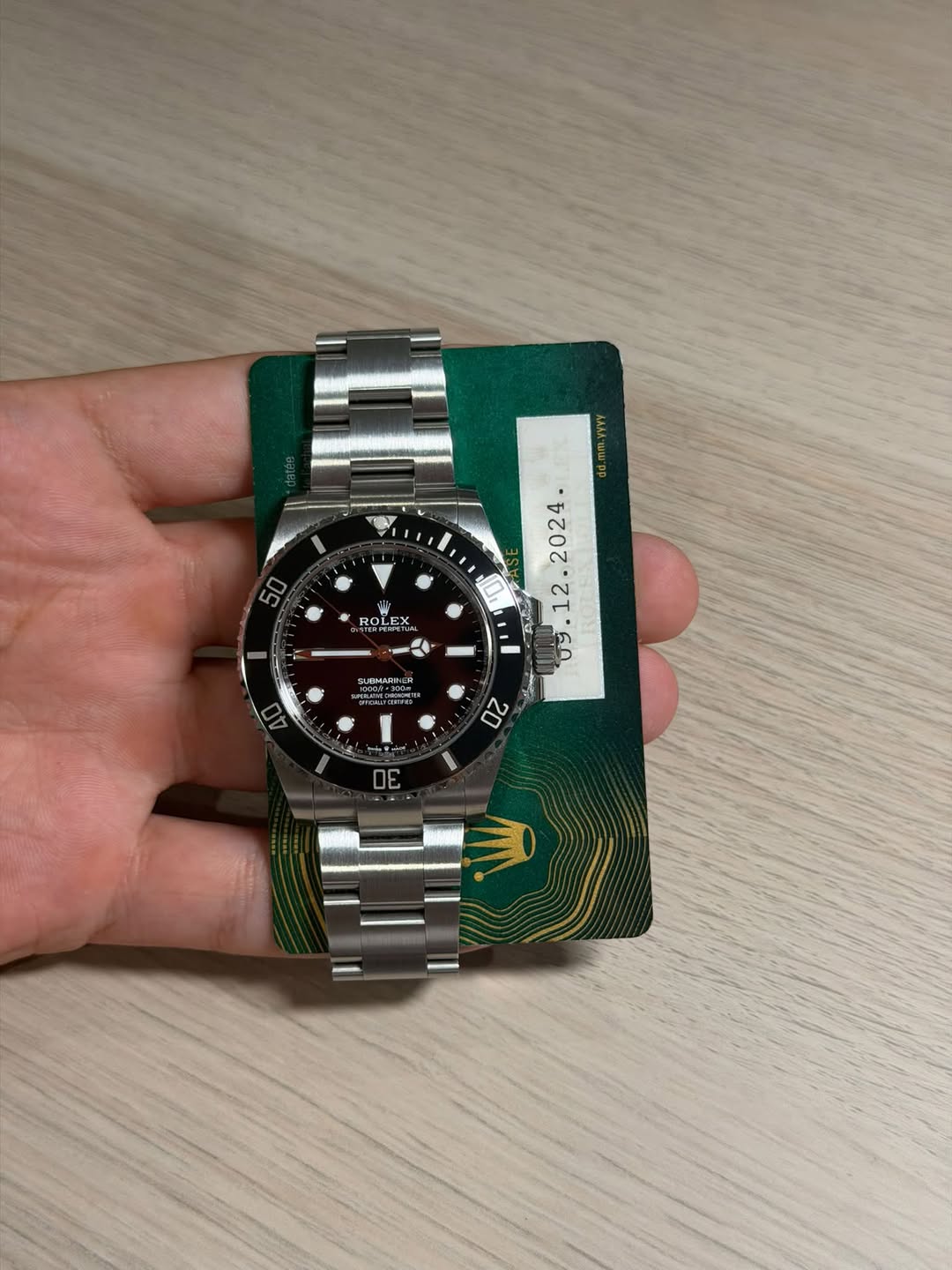 May be an image of wrist watch and text