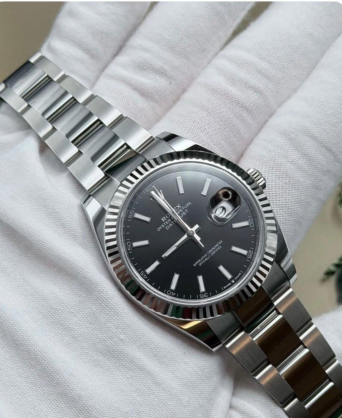 May be an image of wrist watch and text that says '60, 55 mII EX PETUAL IST JAL ST TER OYS DA DAT O 50 20 CHRONORETER CERTARETER UPERLATINVE 25 40 OY SE 3 CE MAOr'