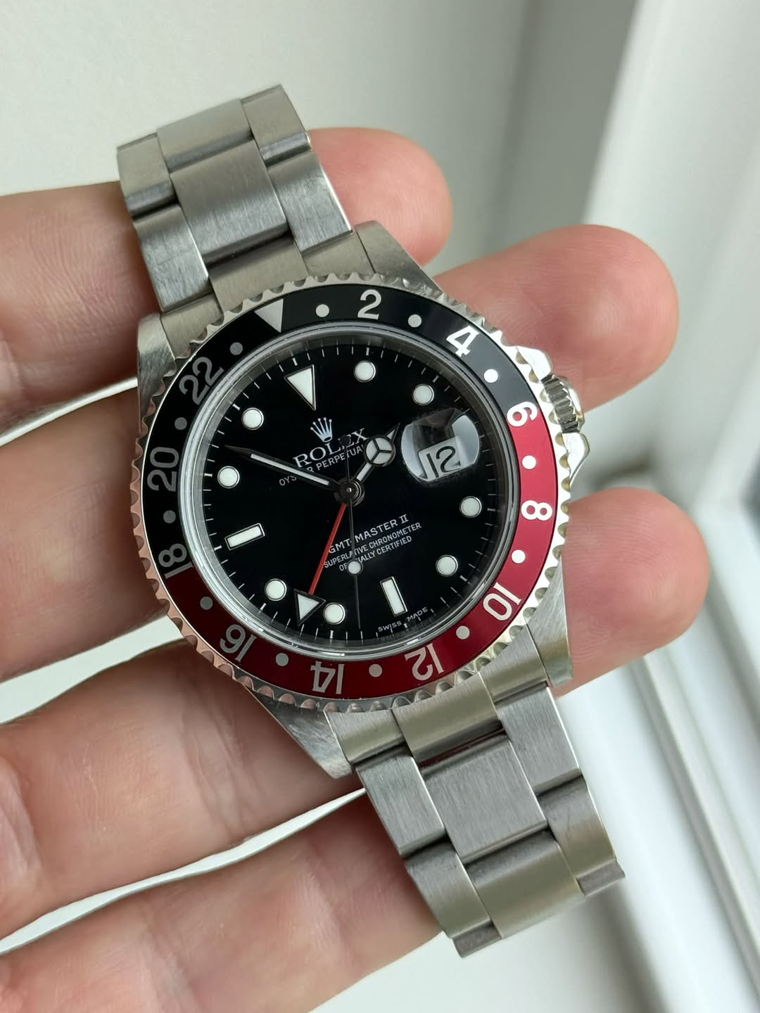 May be an image of wrist watch and text
