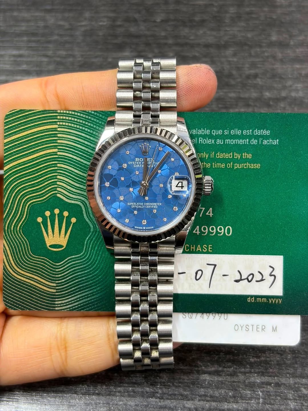 May be an image of wrist watch and text