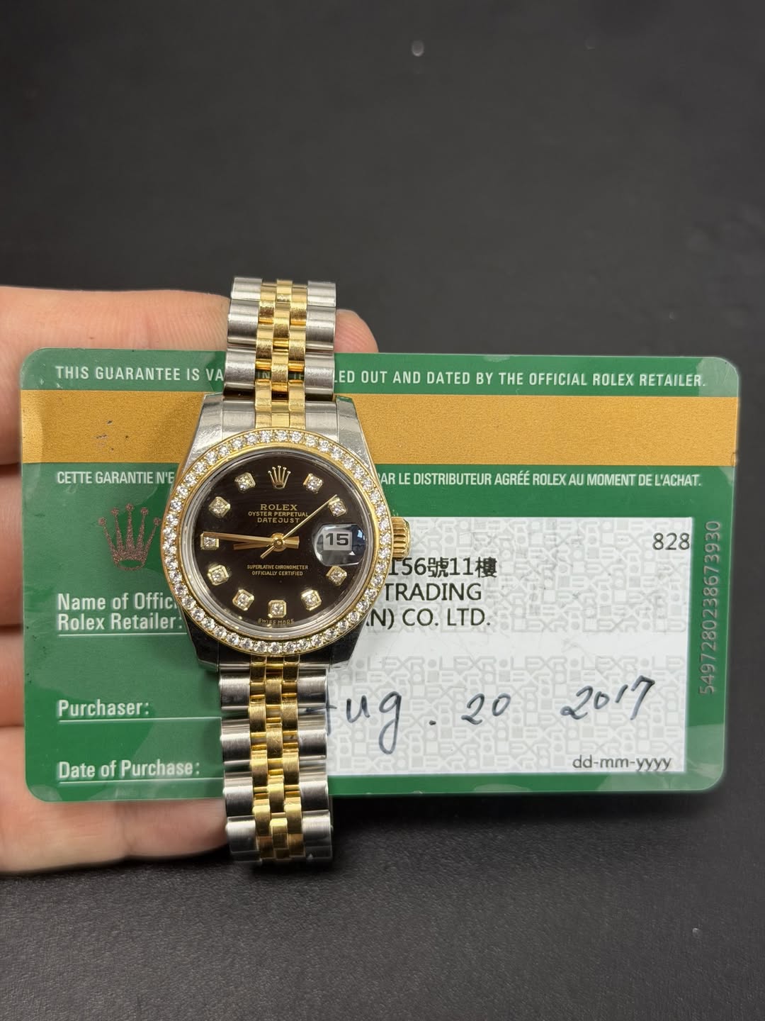 May be an image of wrist watch and text that says 'THIS GUARANTEE IS VA ED OUT AND DATED BY THE OFFICIAL ROLEX RETAILER. CETTE GARANTIEN' S EX 15 Name of Offici Rolex Retailer…