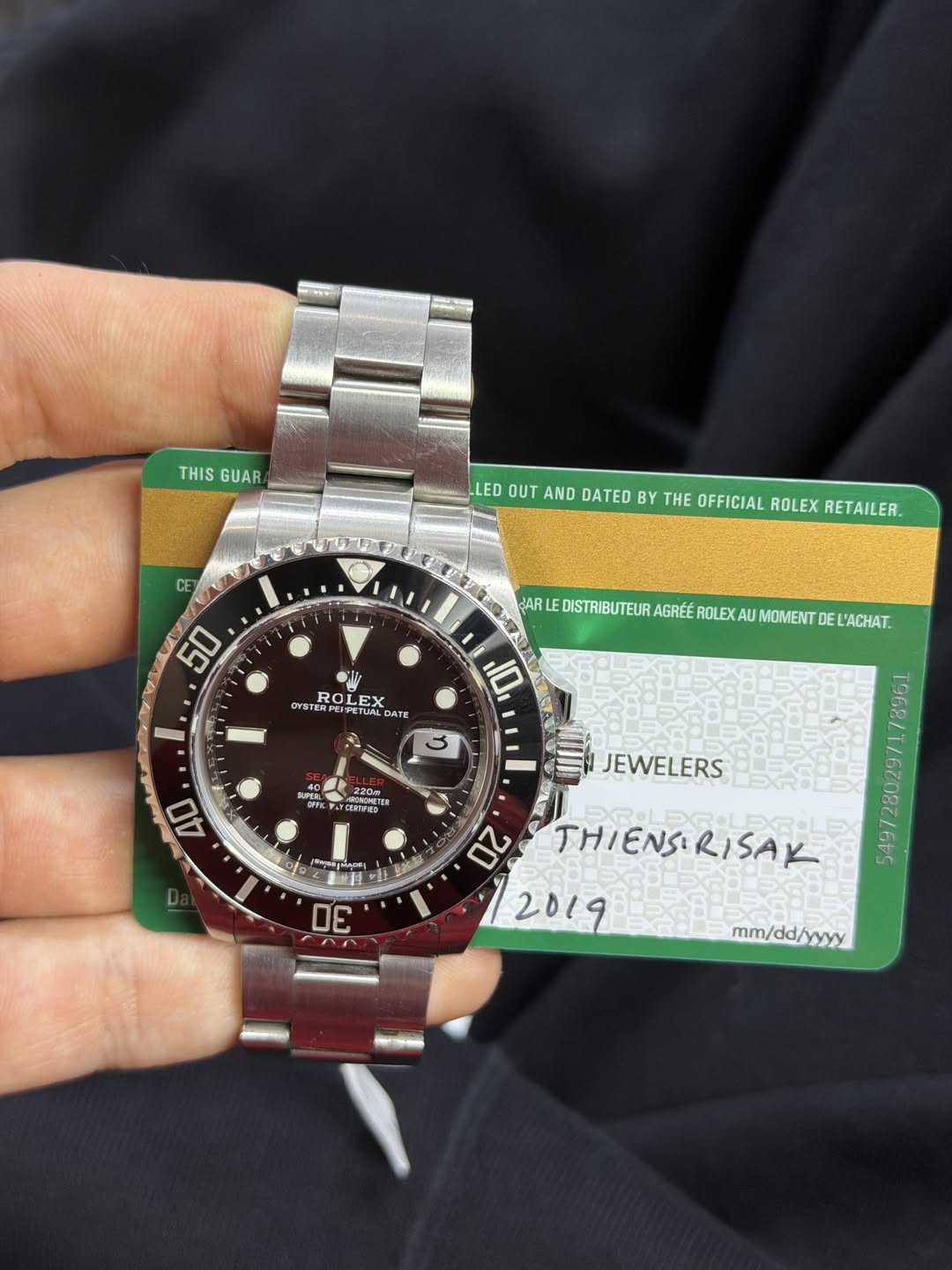 May be an image of wrist watch and text