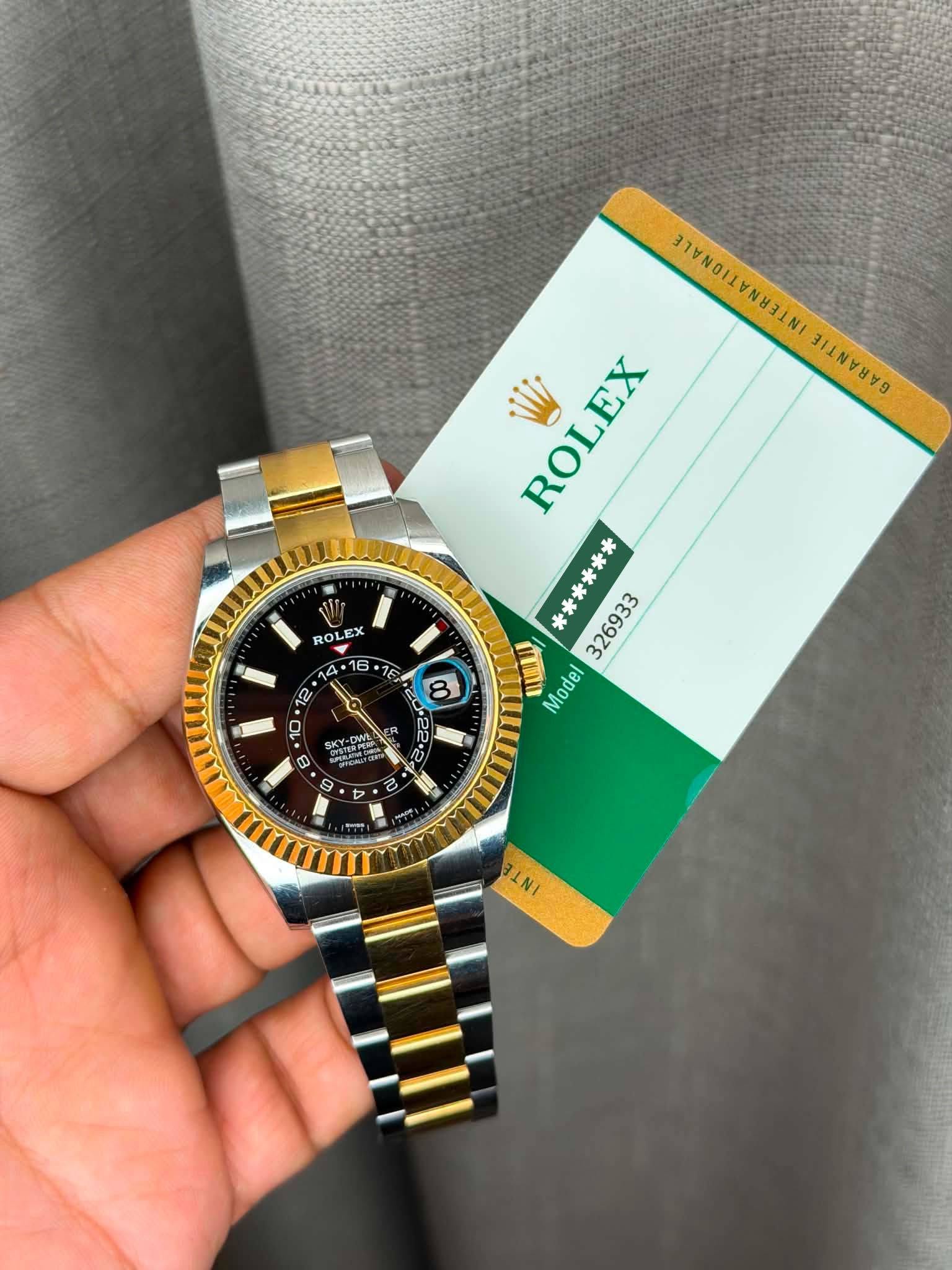 May be an image of wrist watch and text