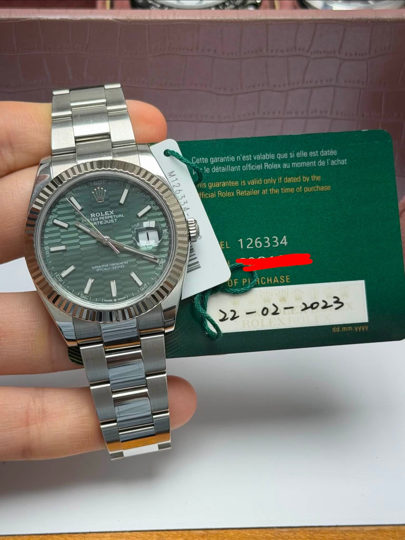May be an image of wrist watch and text