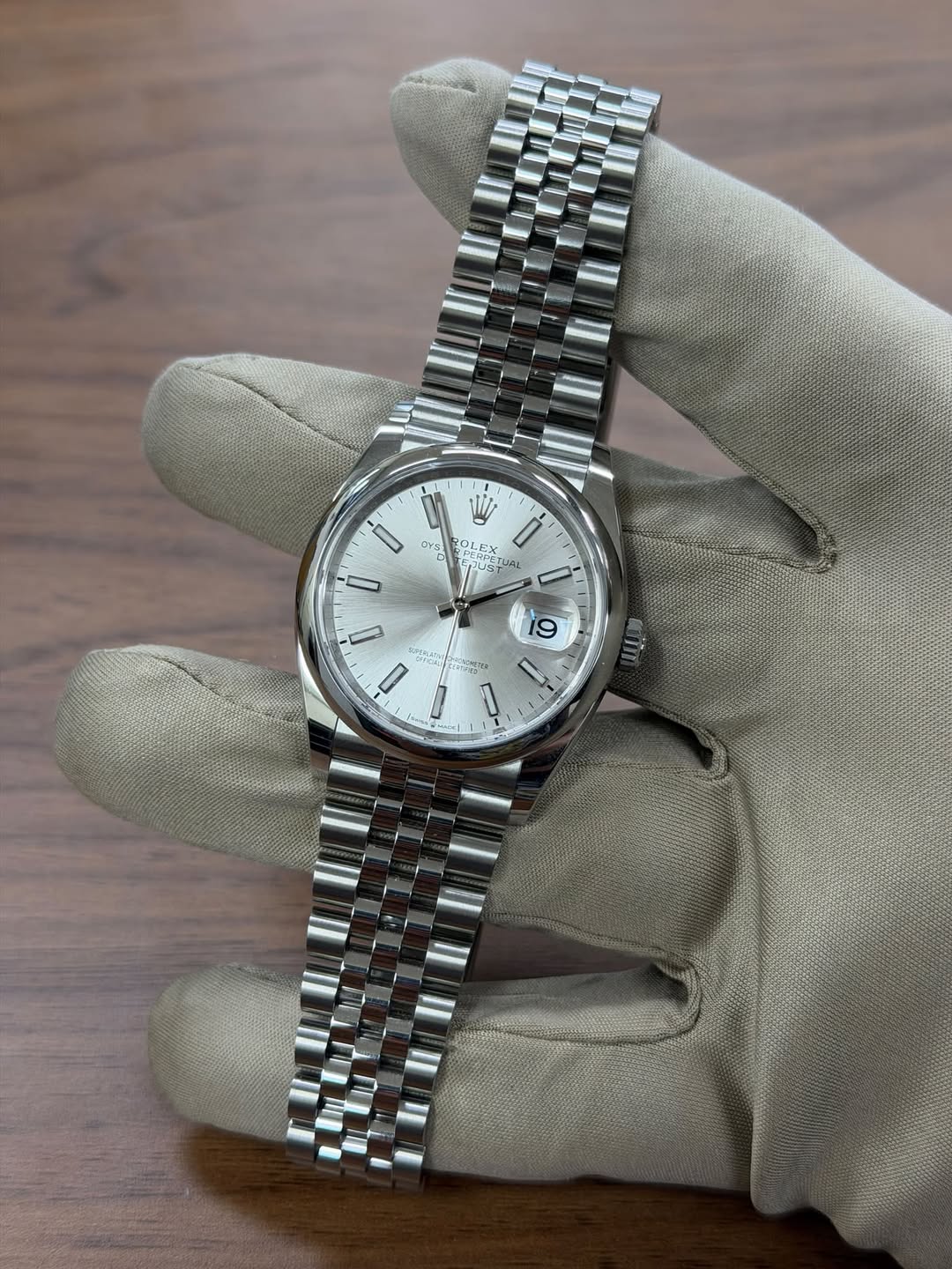 May be an image of wrist watch and text
