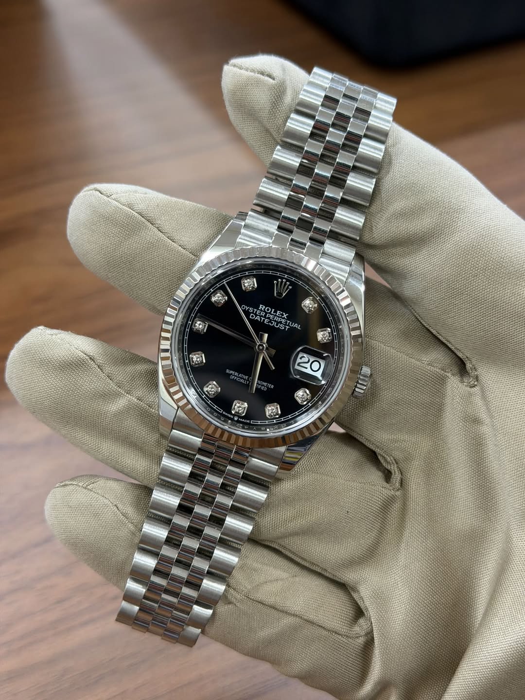 May be an image of wrist watch and text