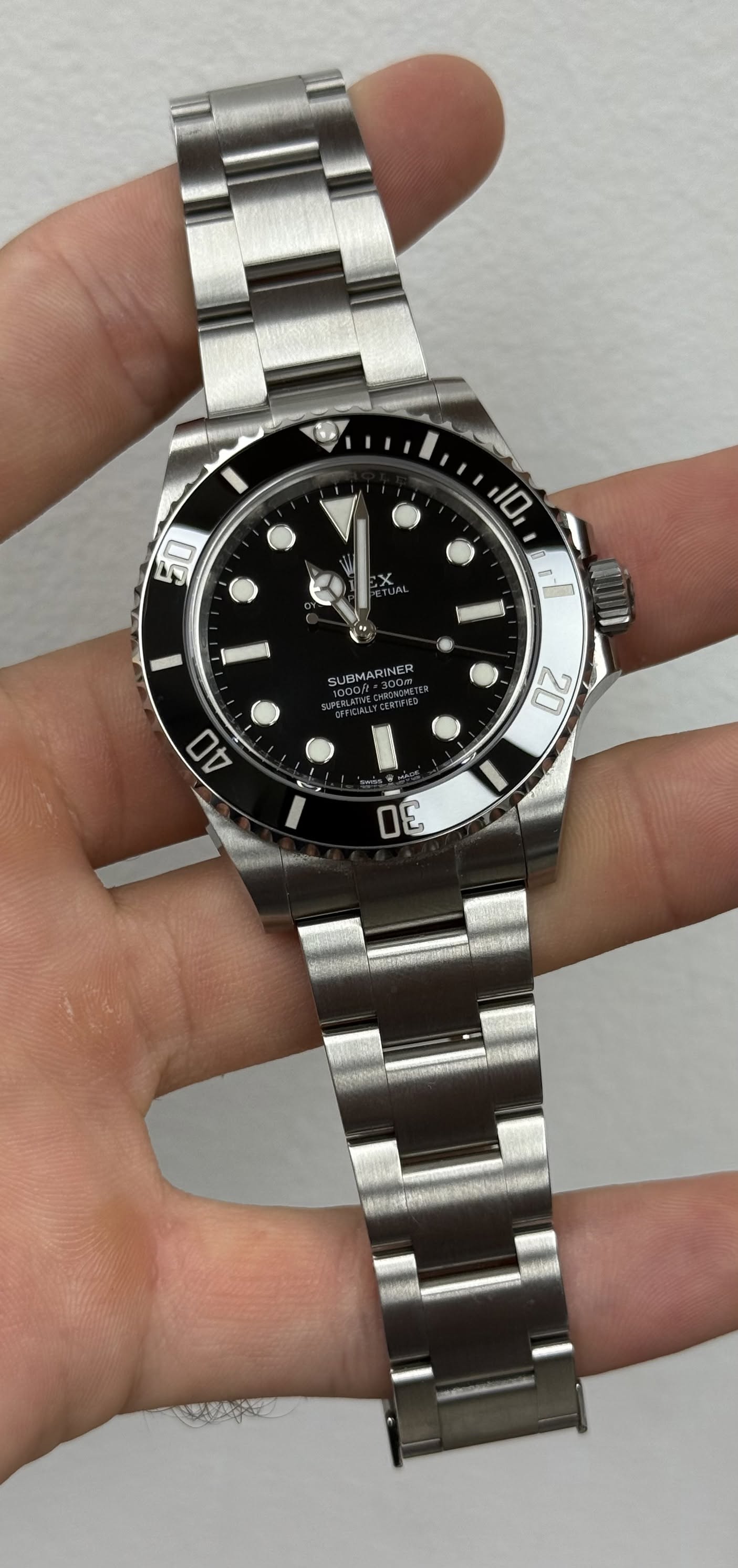 May be an image of wrist watch and text