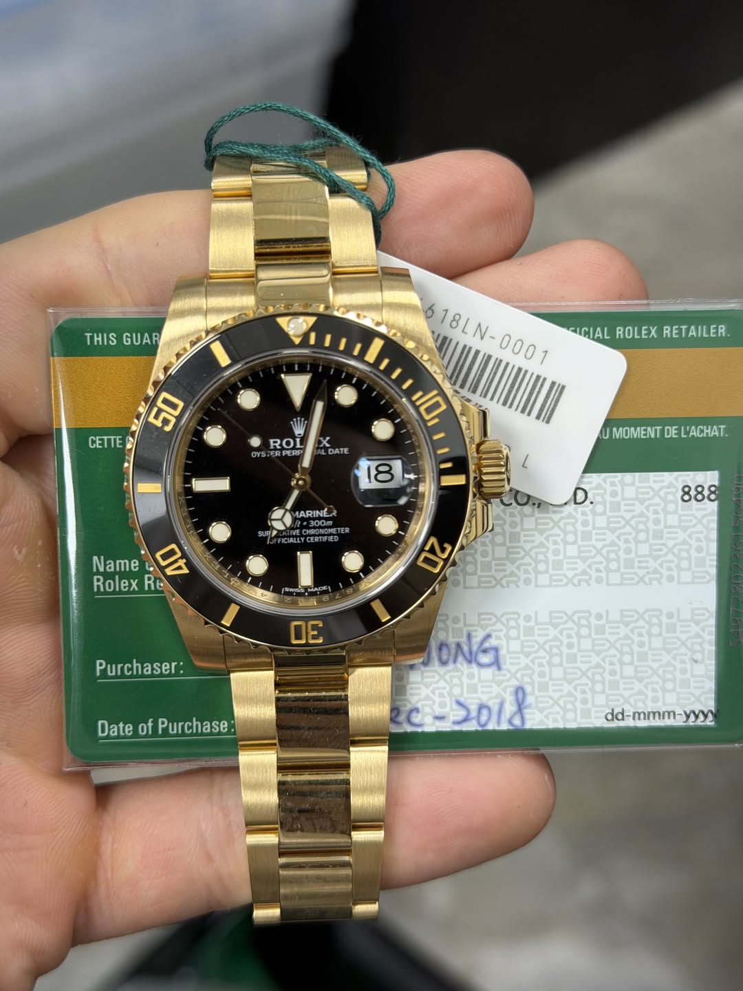May be an image of wrist watch and text that says 'THIS THISGUAR GUAR CETTE 6 18LN-0001 ICIALROLEXRETAILER. FICIAL ROLEX RETAILER. 10 50 ROL ERPERP DATE 18 * UMOMENT DE L'ACHAT.…