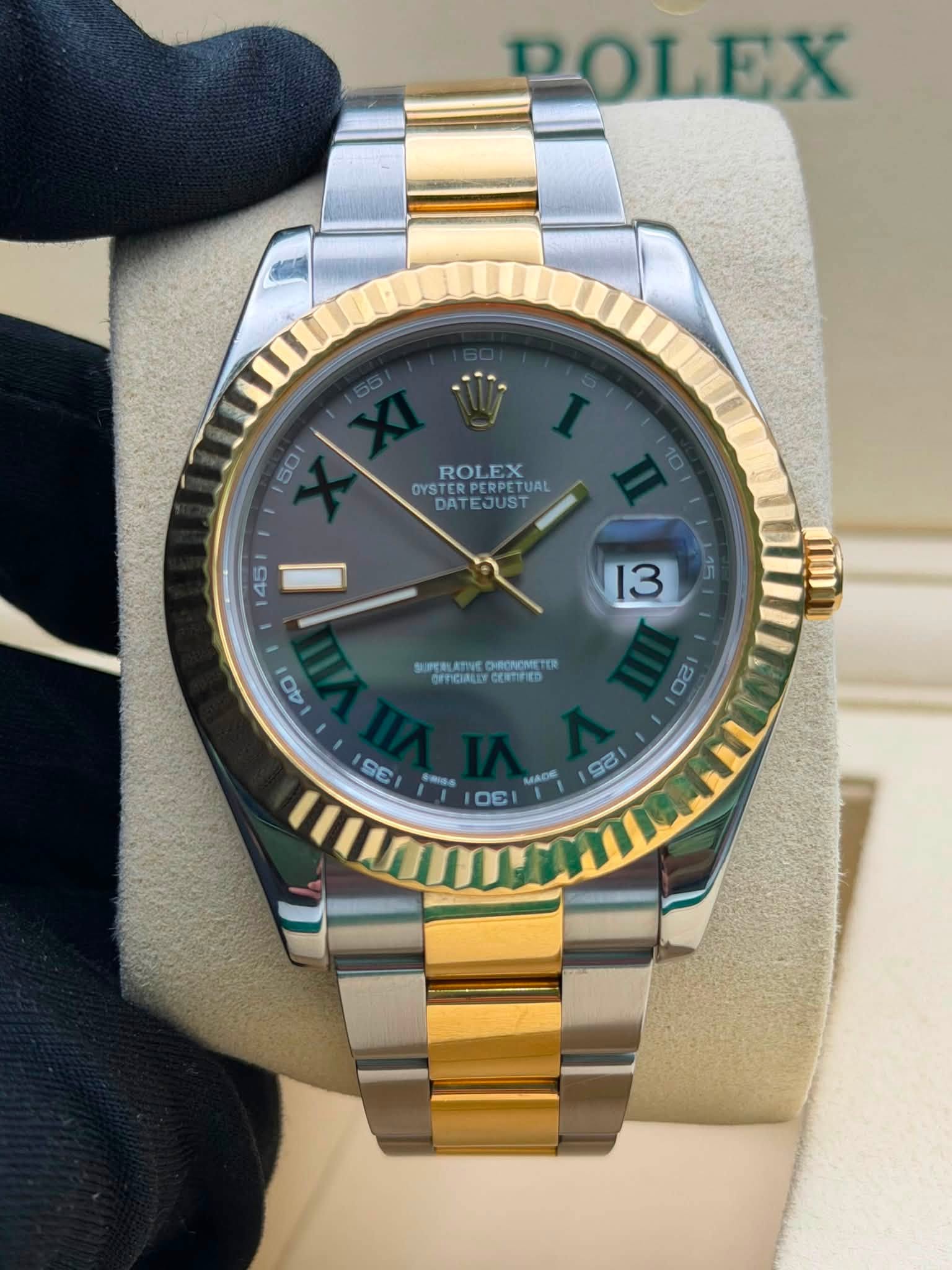 May be an image of wrist watch and text