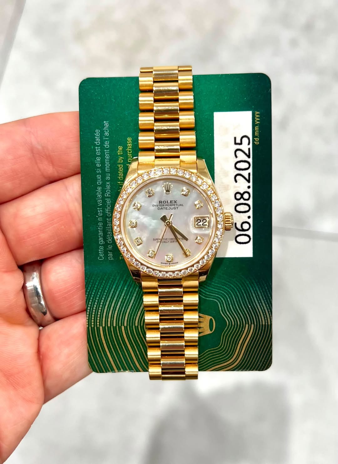 May be an image of wrist watch and text