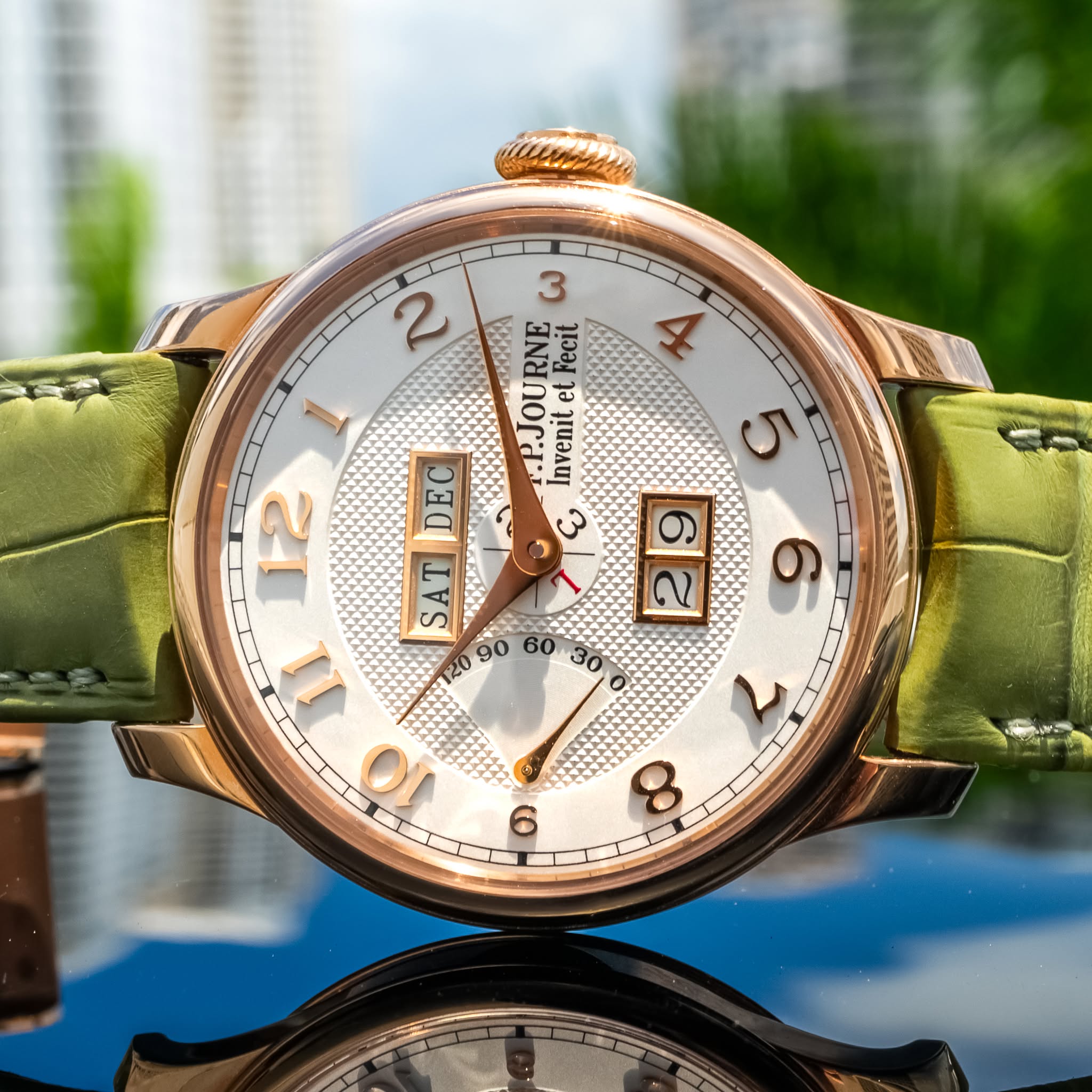 May be an image of wrist watch and text that says '2 م .P.JOURNE et Fecit 8 1 veni Invenit 5 12 SATDEC 1 E ن SAT '