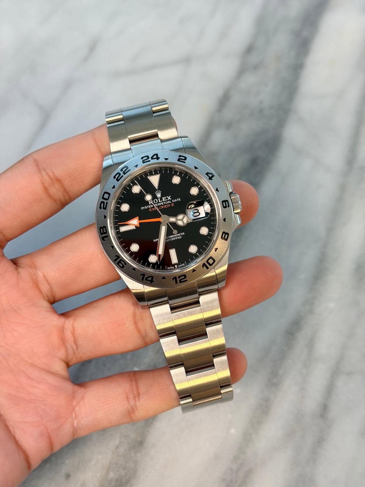 May be an image of wrist watch and text