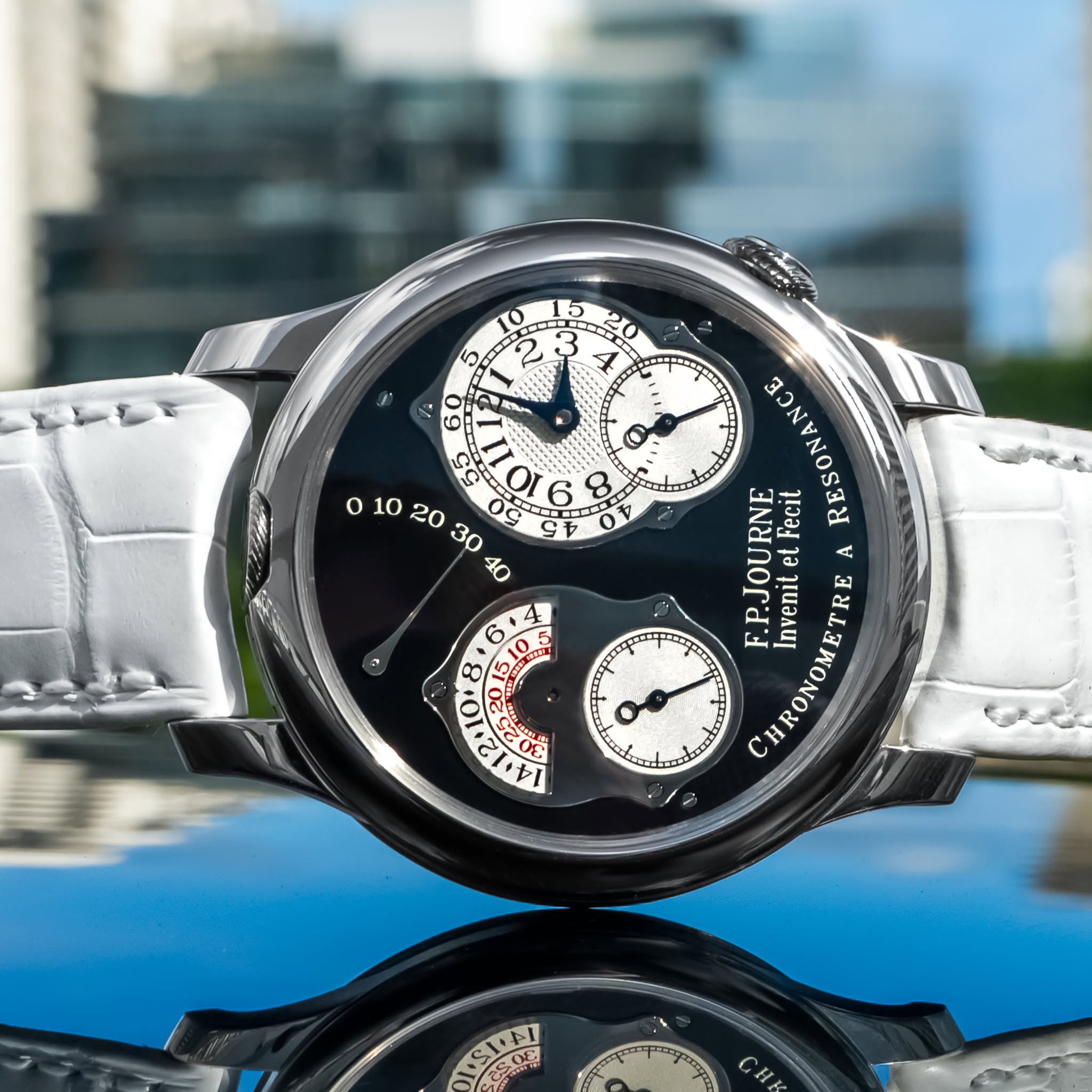 May be an image of wrist watch and text