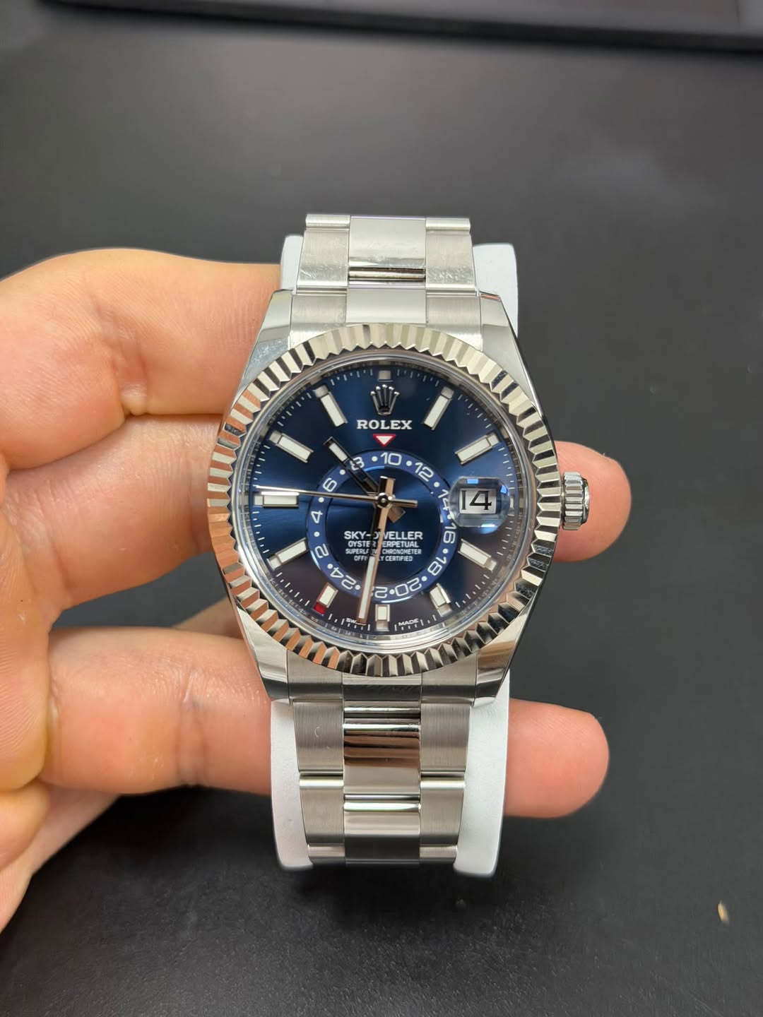 May be an image of wrist watch and text