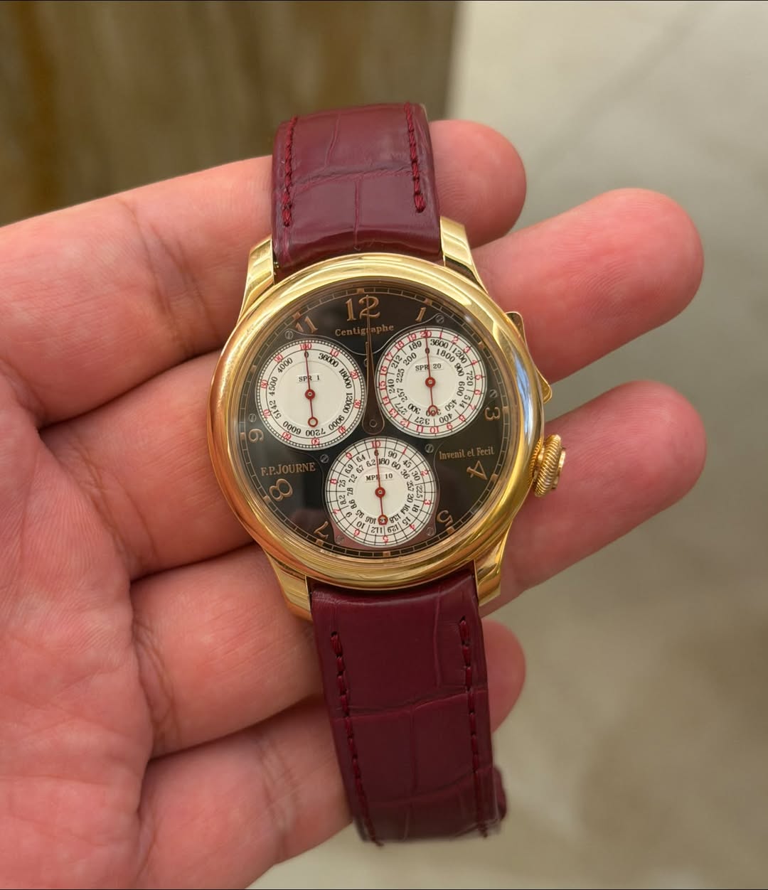 May be an image of wrist watch and text