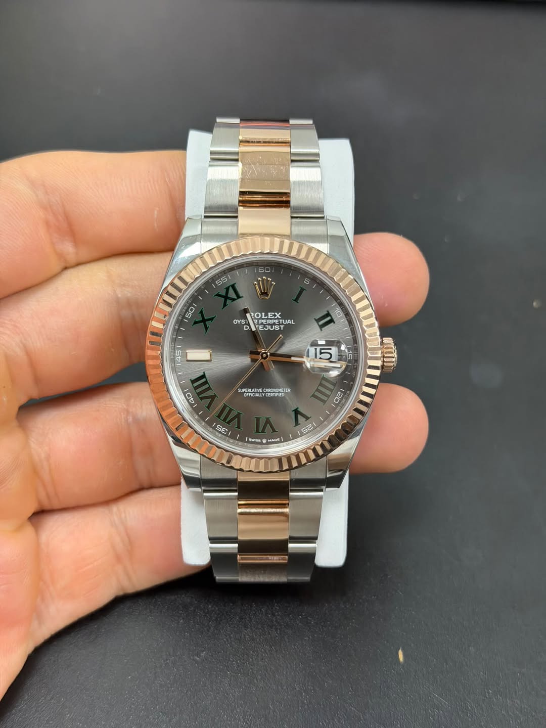 May be an image of wrist watch and text