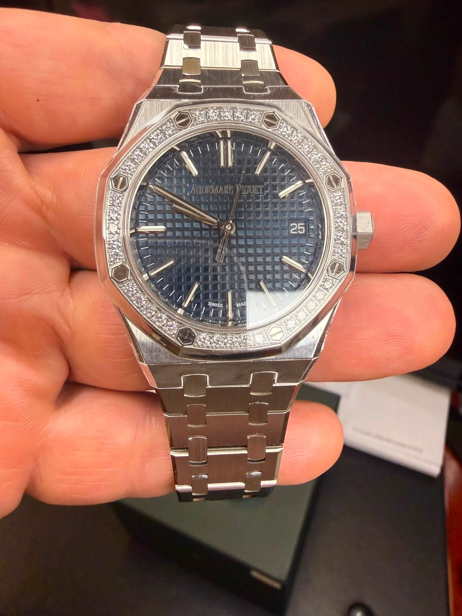 May be an image of wrist watch and text that says '25 swIss MAI'