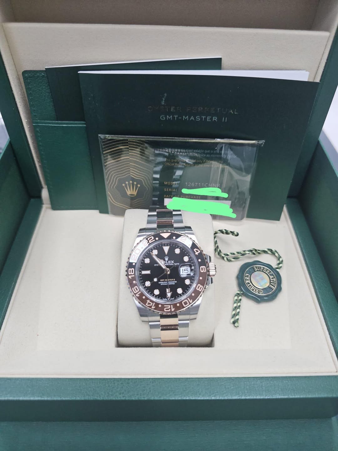 May be an image of wrist watch and text that says 'STERII W 126711CHNR 2 4 - - OLE LES አይኤዊ 15 の inIh G 一 TERSS RFTED COEEN'