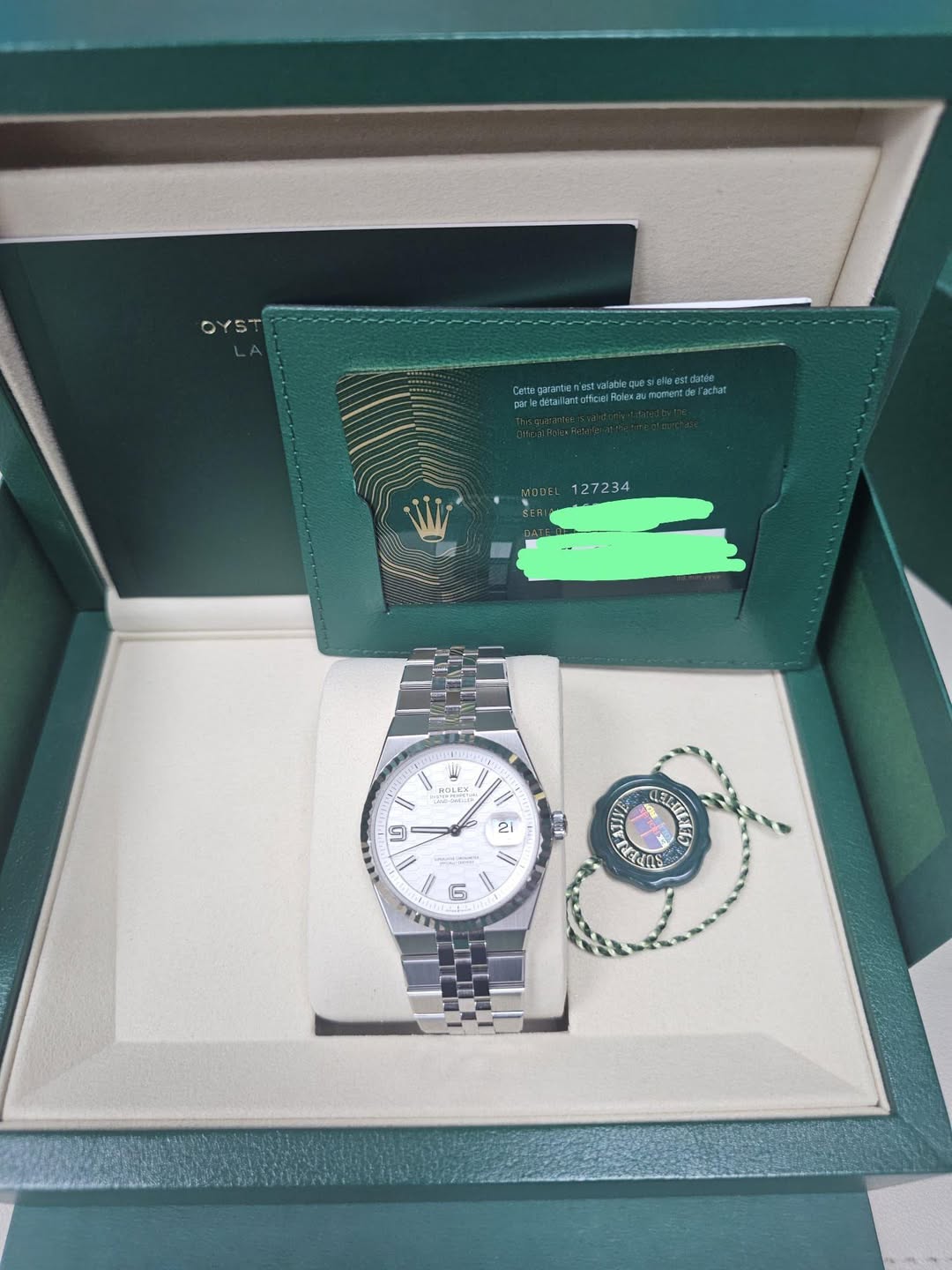 May be an image of wrist watch and text