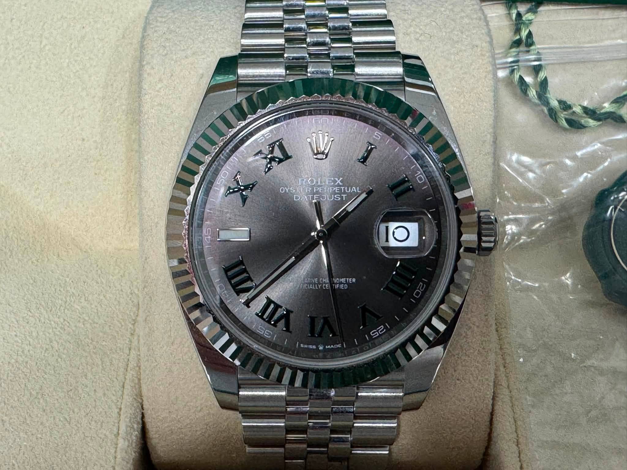 May be an image of wrist watch and text that says '5 50 I XI W OYSTIRPETPETUAL OYS CROLEX OYSTERPERPETUA YSRER TUAL DATEJUST JUST DAT L10 45 I O E πο AHOn π π'