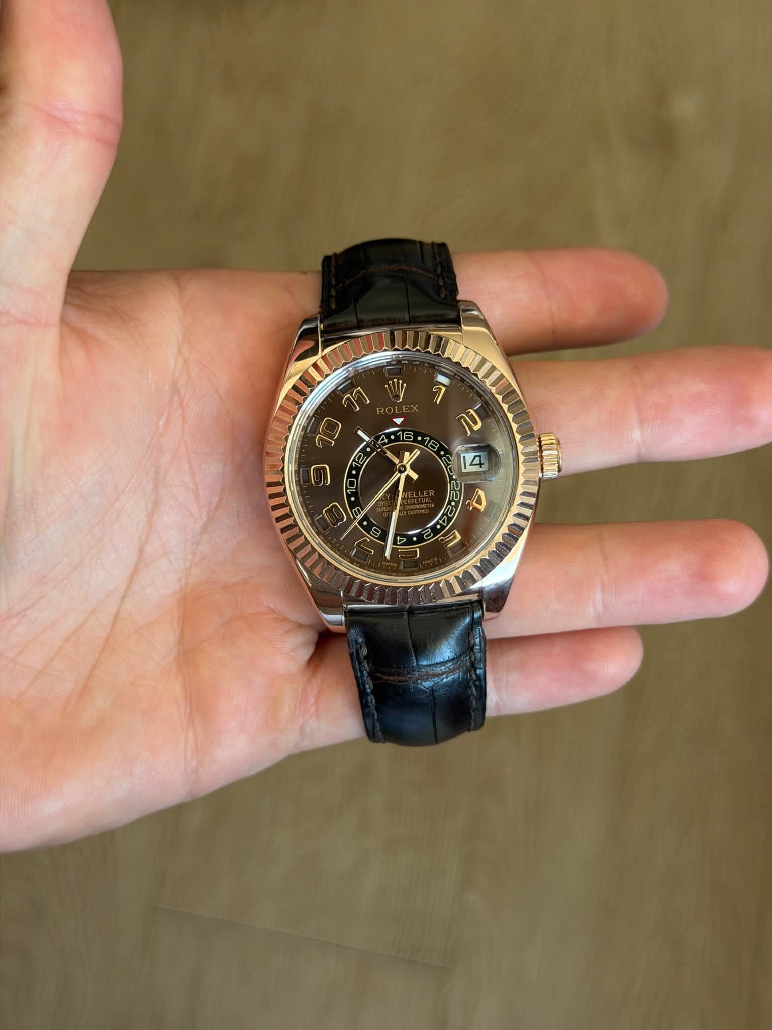 May be an image of wrist watch and text