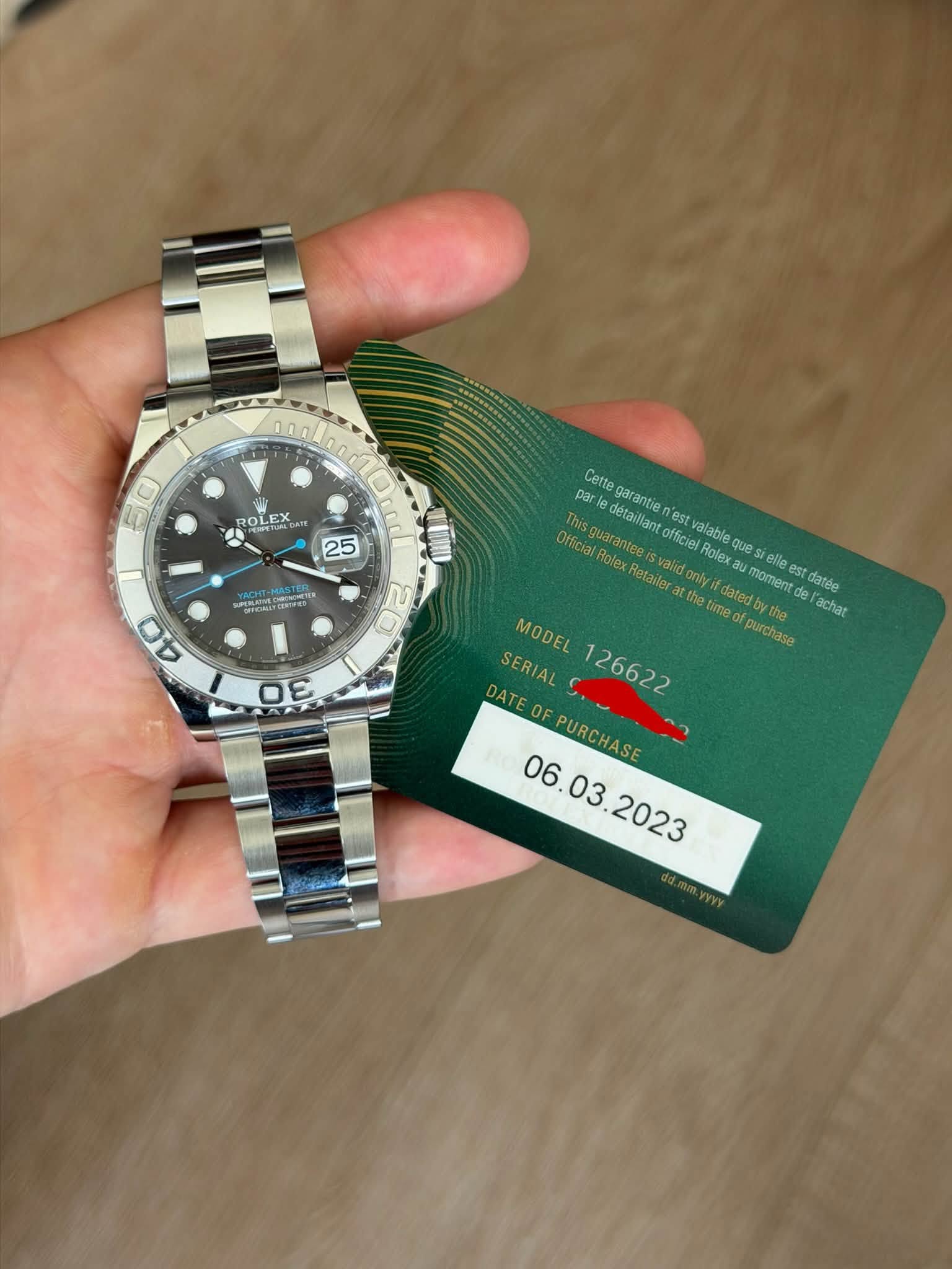May be an image of wrist watch and text that says '50 O ROL OLEX GATE OLEX 25 ASTER Cette par| nark garantie est Thisquaranteeis antees rantee detaillant officiel Rolex elle…