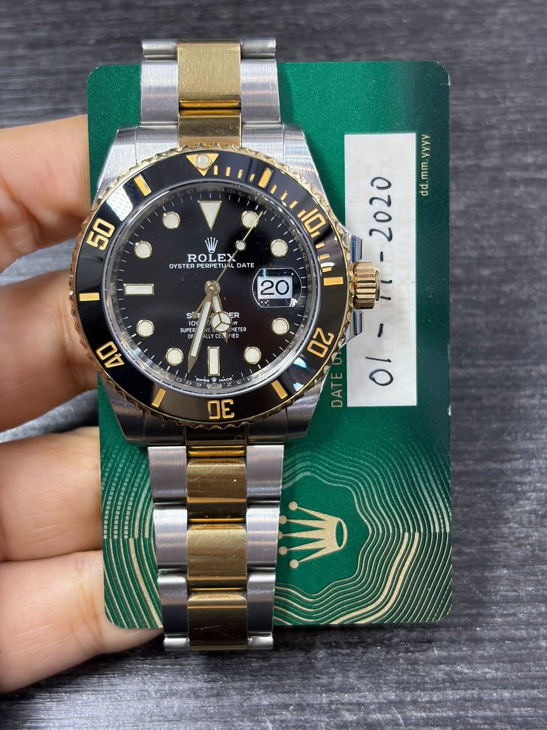 May be an image of wrist watch and text