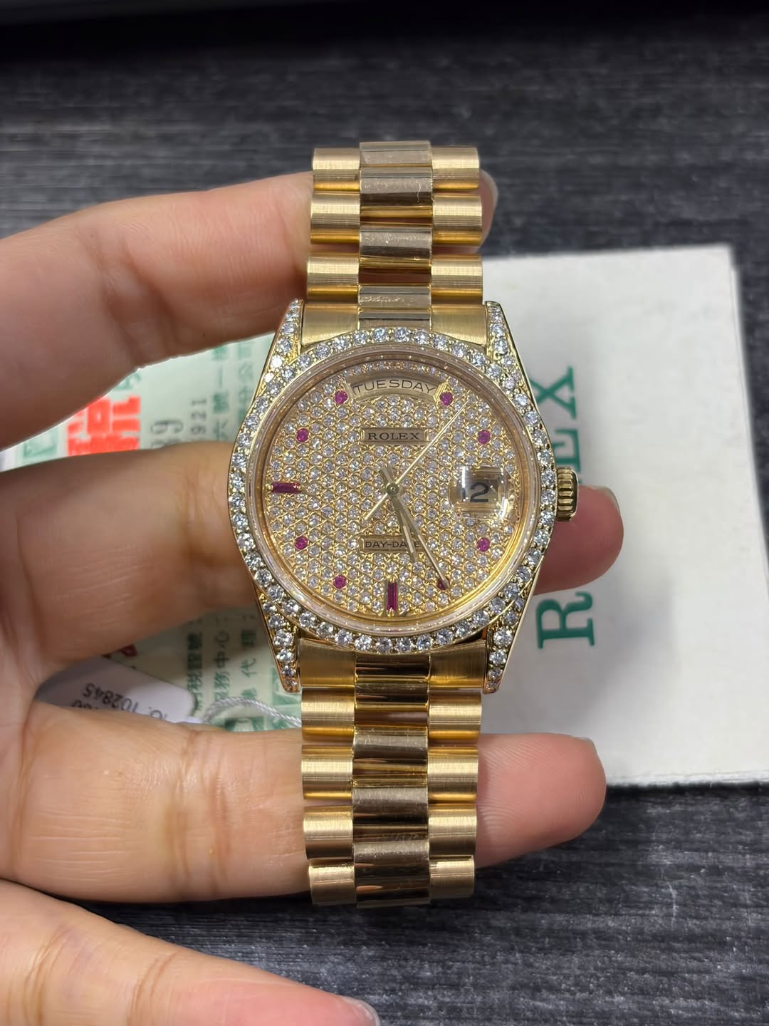 May be an image of wrist watch and text
