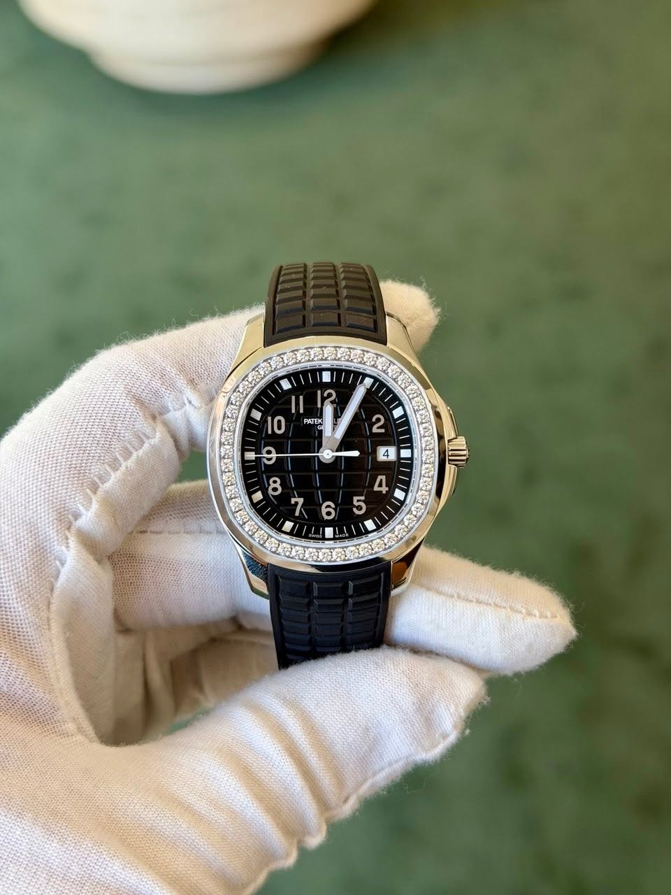 May be an image of wrist watch and text that says '1 II 12 I0 PATEK '