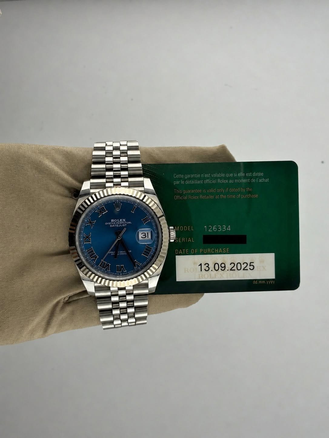 May be an image of wrist watch and text that says 'ROLEX 31 5 e 126334 I ROT '