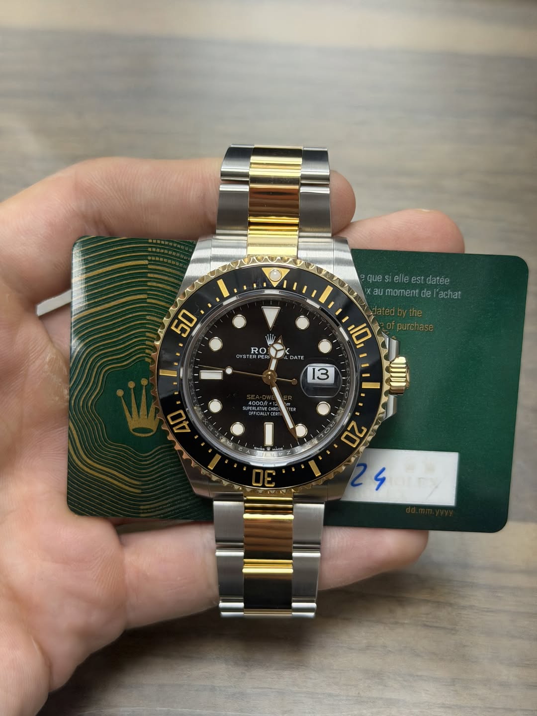 May be an image of wrist watch and text