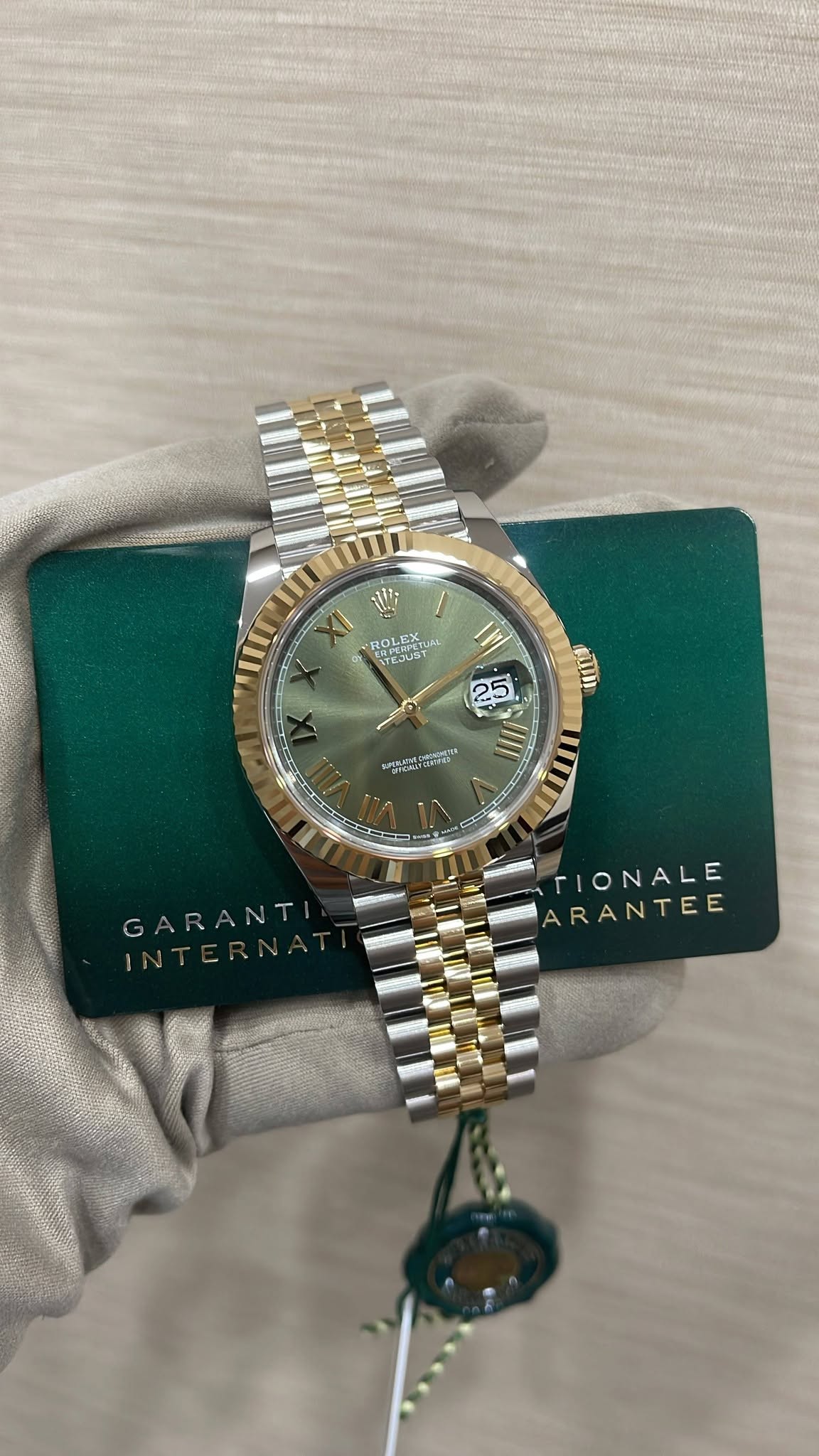 May be an image of wrist watch and text