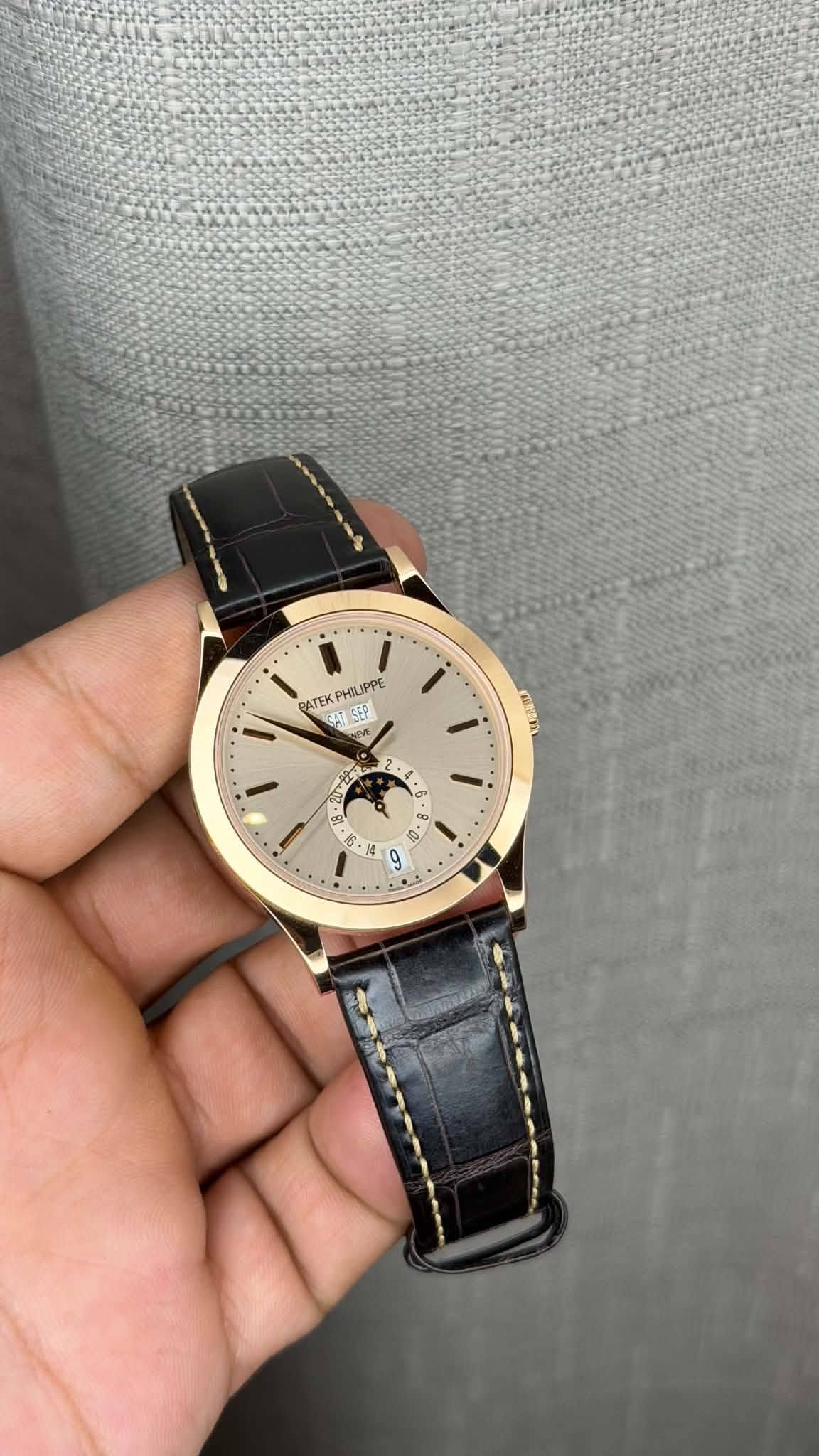 May be an image of leather, wrist watch and text