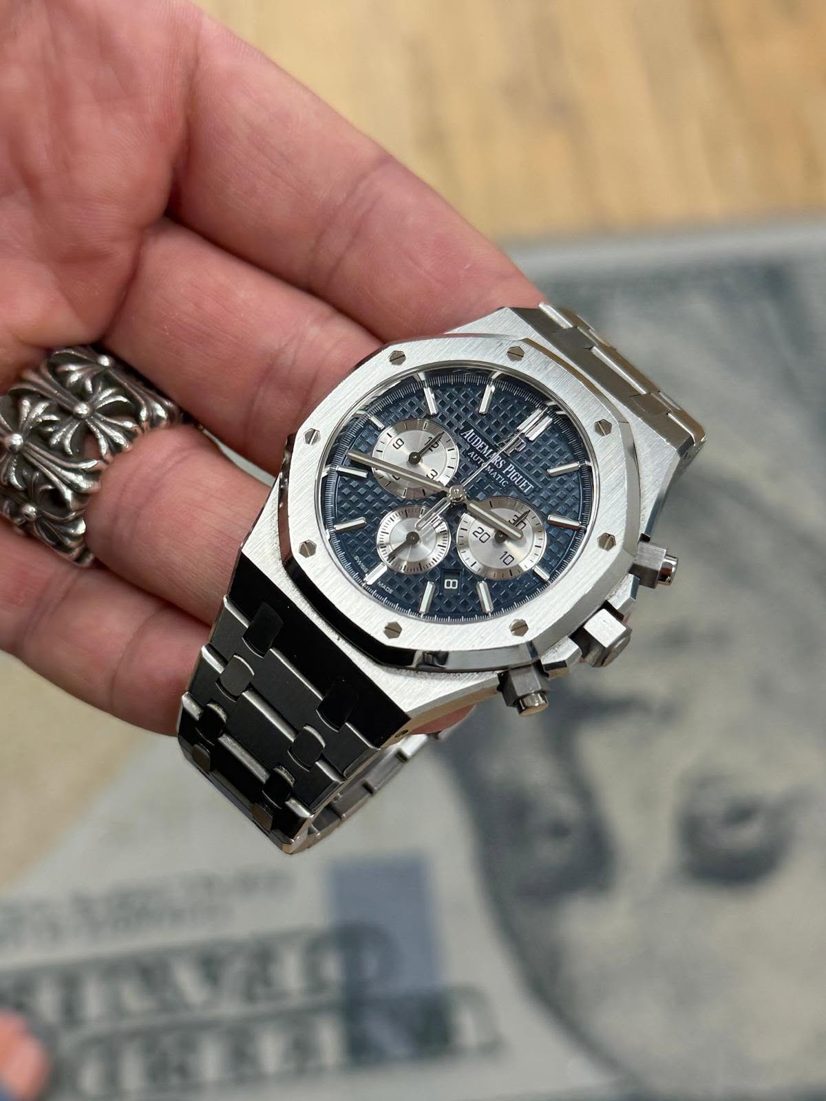 May be an image of wrist watch and text