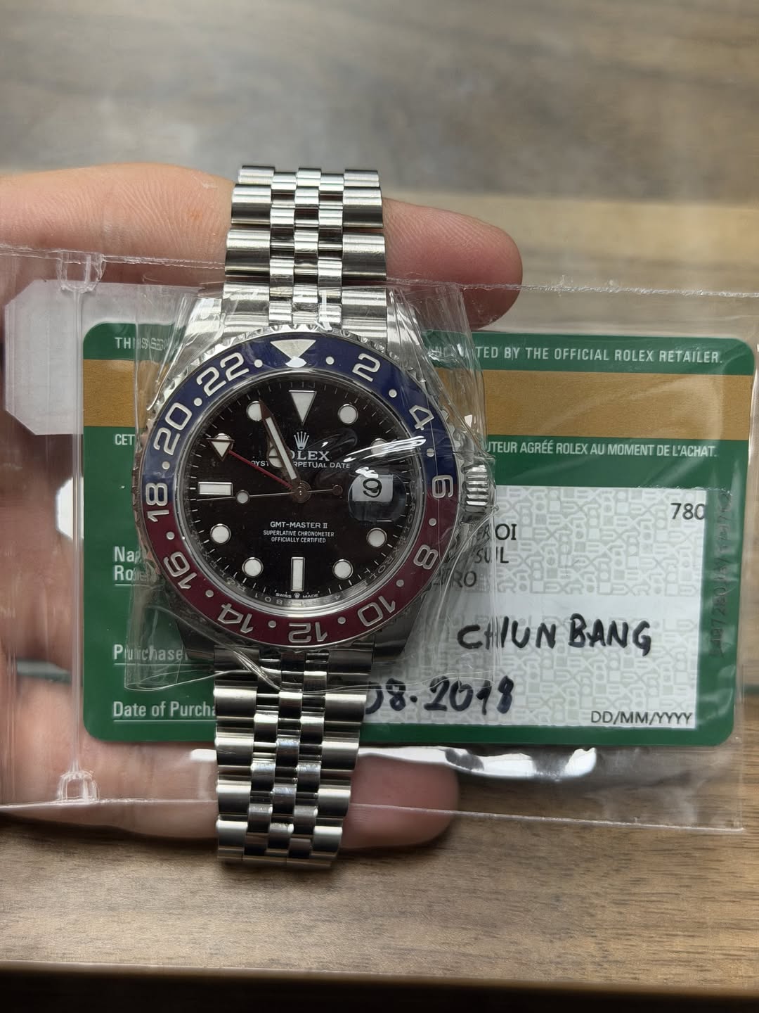May be an image of wrist watch and text