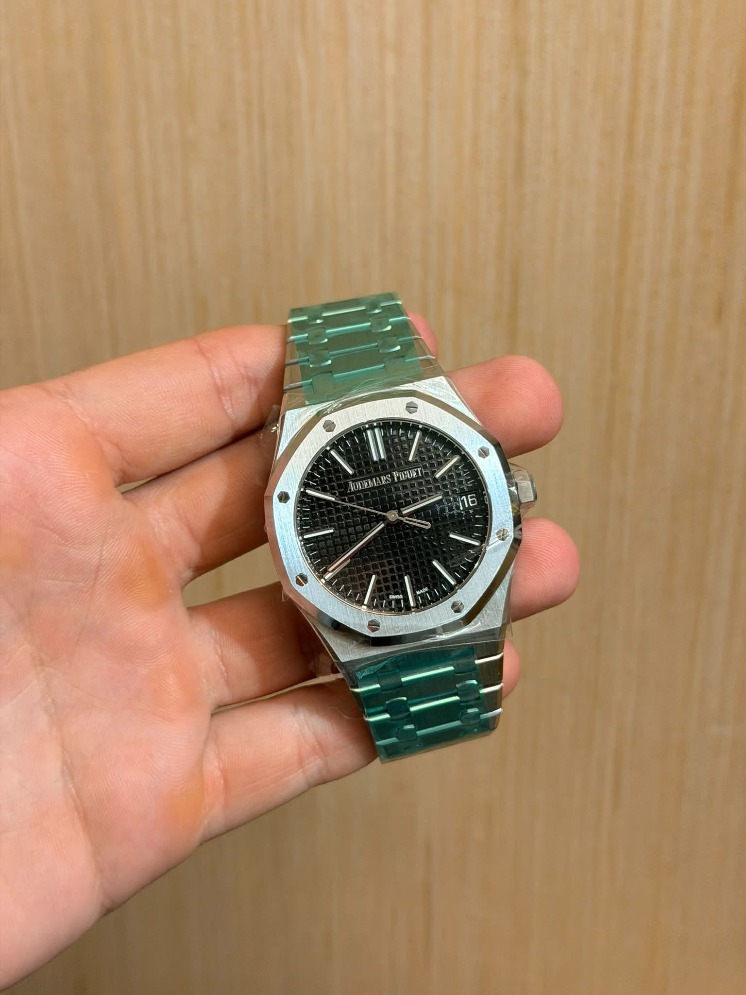 May be an image of wrist watch and text