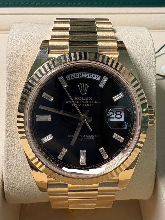 May be an image of wrist watch and text