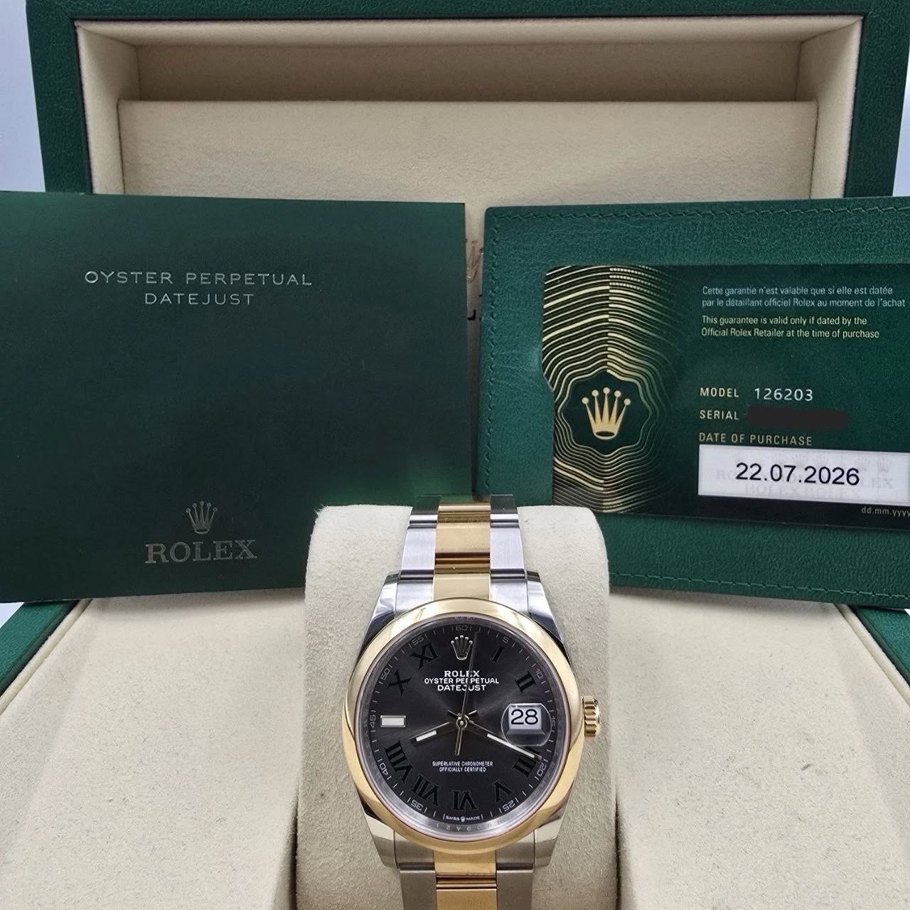 May be an image of wrist watch and text