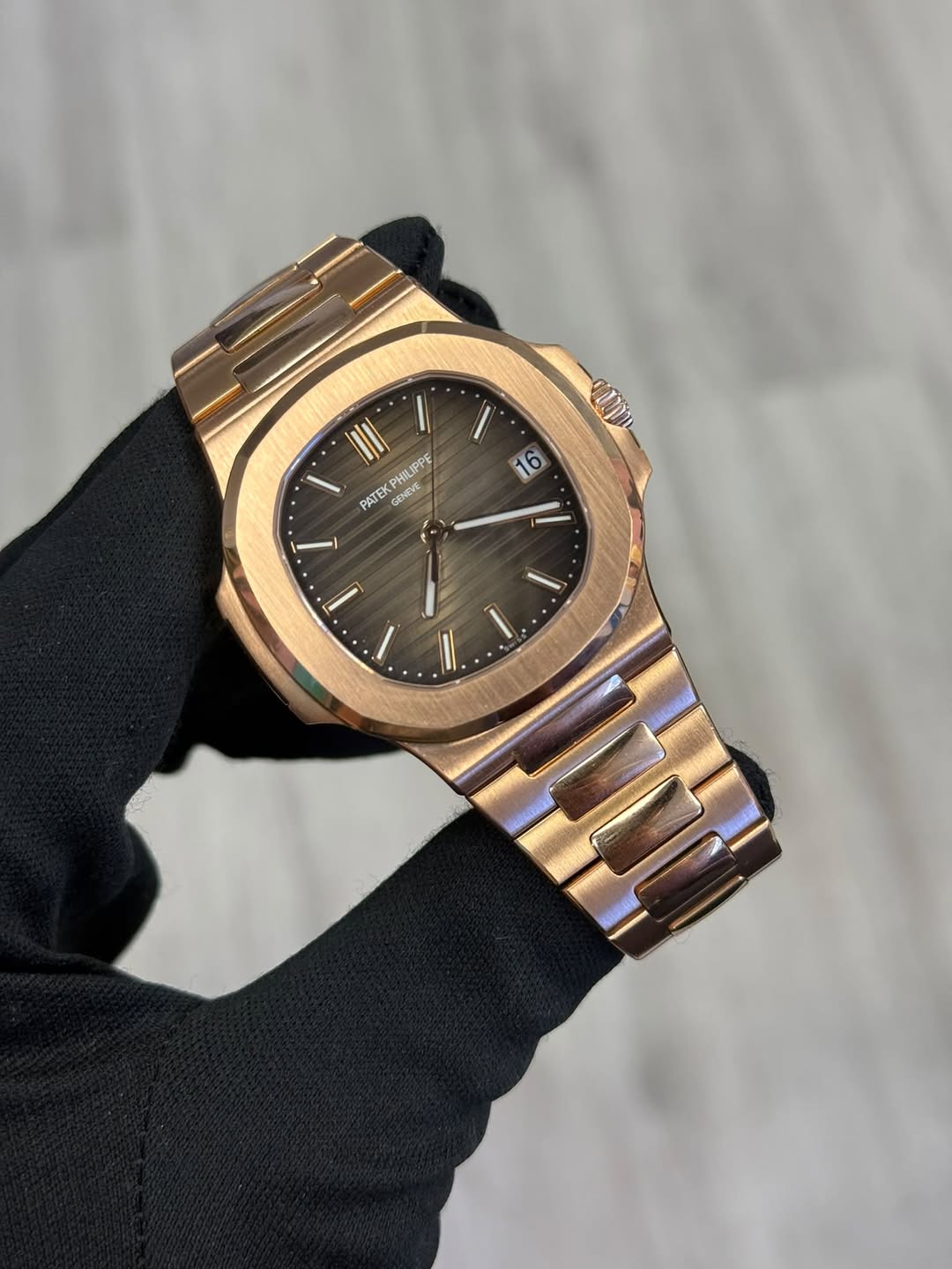 May be an image of wrist watch and text that says 'αππ PATEK S GENEVE PHILIPPE / 66 I/'