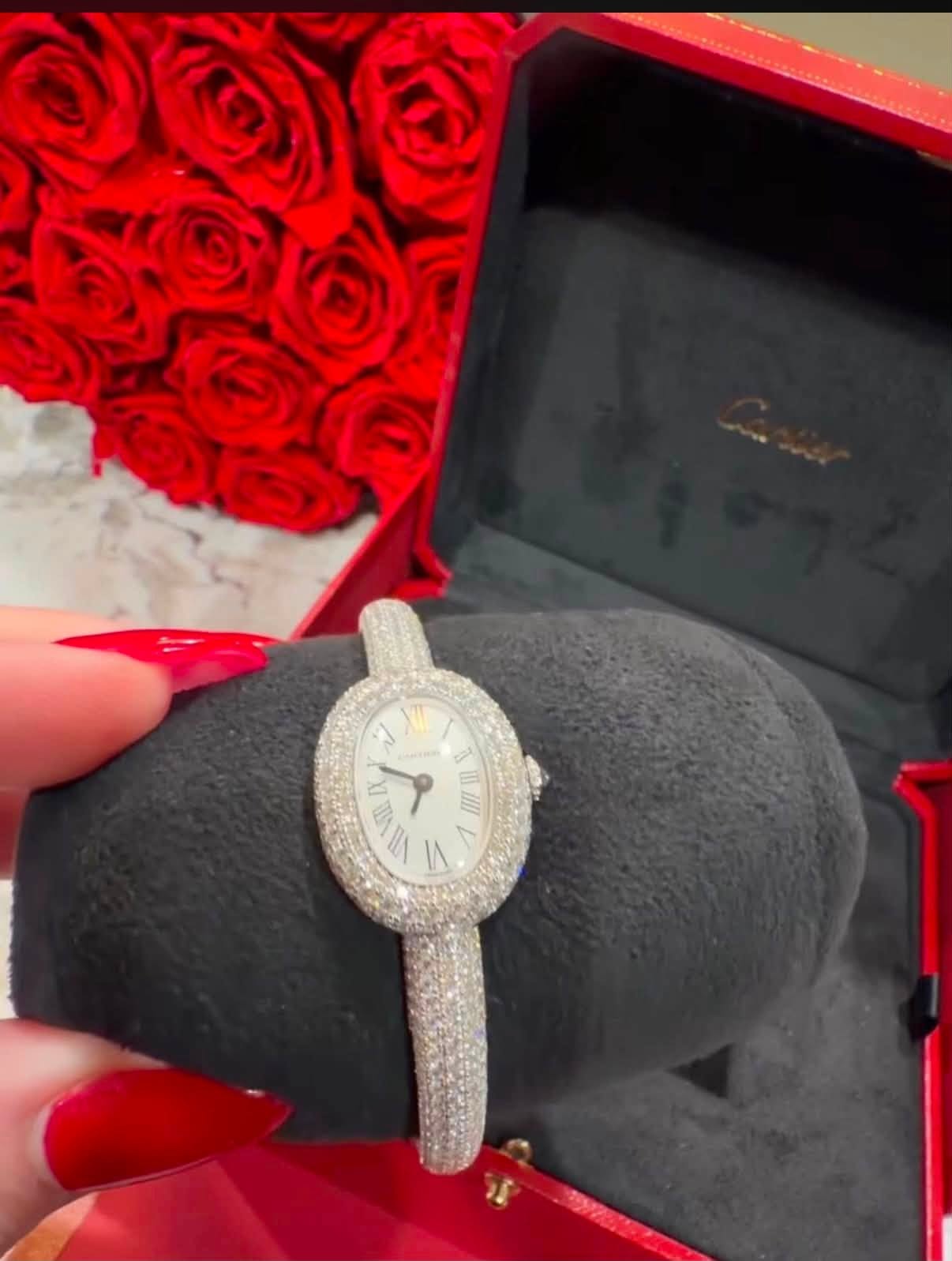 May be an image of wrist watch, ring and text