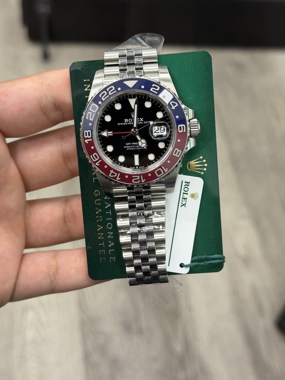 May be an image of wrist watch and text