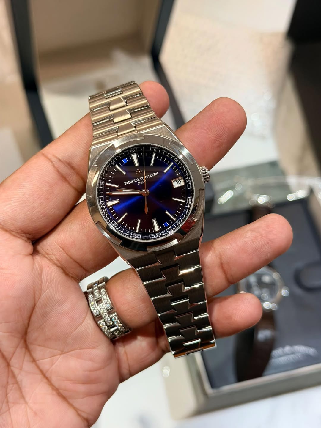 May be an image of wrist watch and text