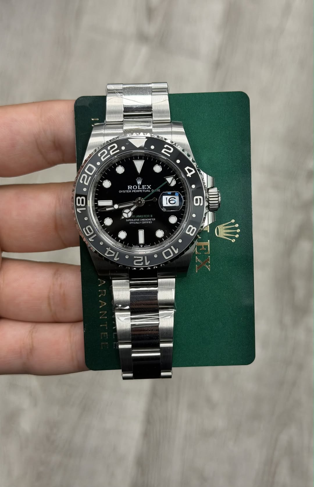 May be an image of wrist watch and text